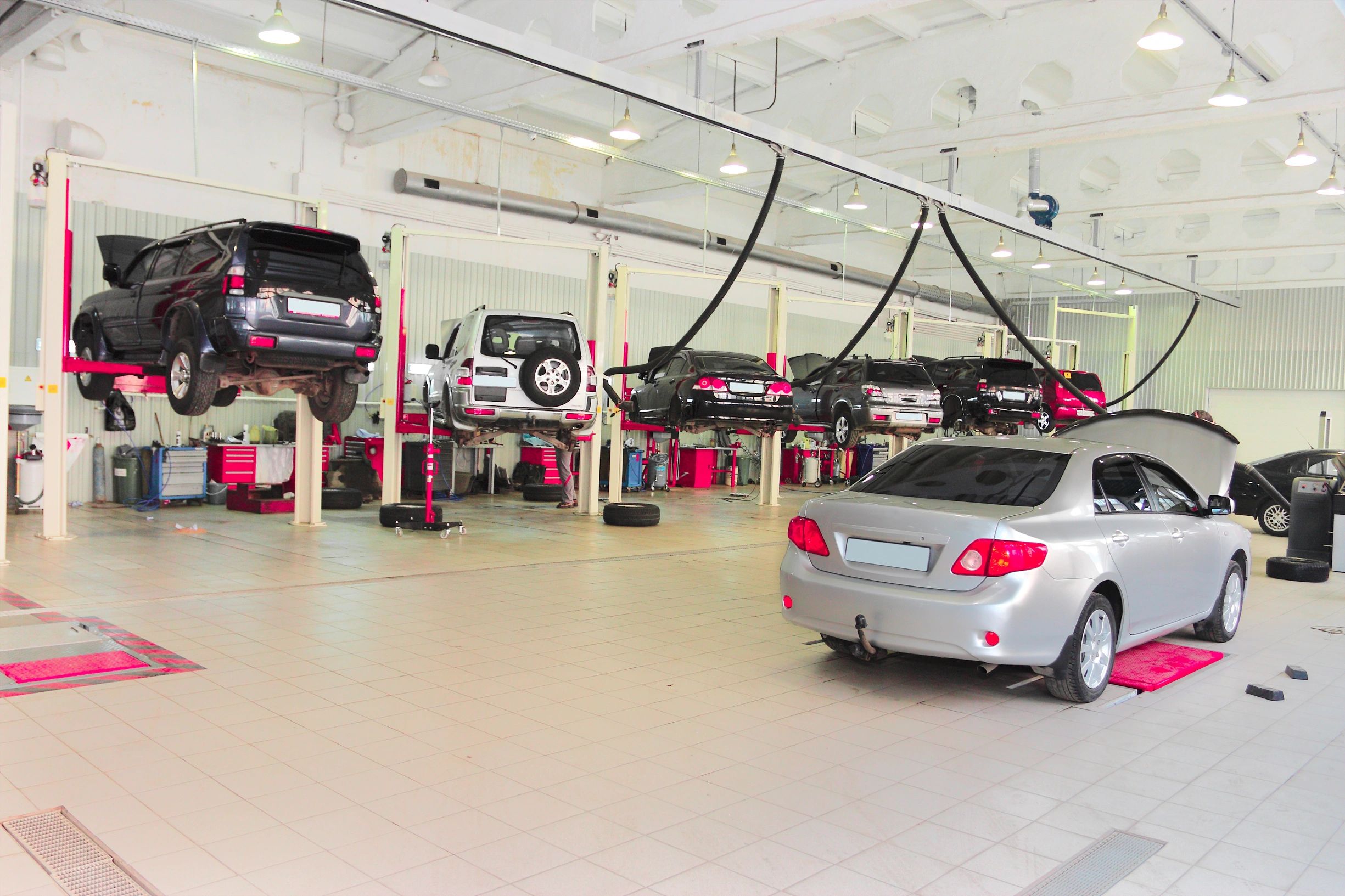 Technician working on Japanese car in modern repair shop